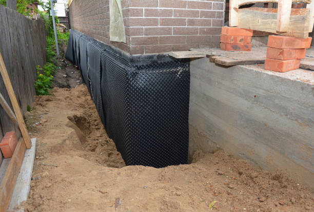 Happy homeowners after waterproofing job in Duff